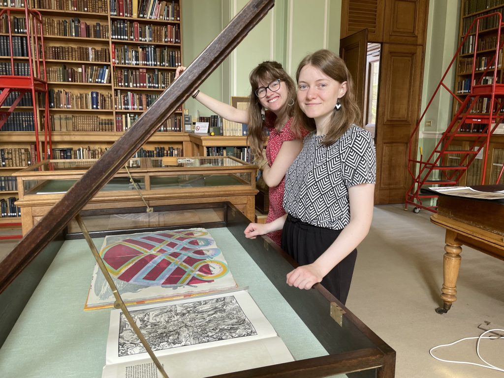 Elena Trowsdale and Anja Peters with the Apocalypse display case